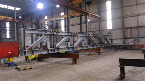 a metal fabrication plant with a cutting department, a drilling 